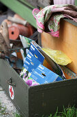 Old first aid box with packs of bulbs for autumn planting