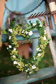 Heart of boxwood, hydrangea blossoms, and lady's mantle