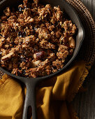 Crispy muesli with nuts and honey in a pan