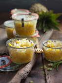 Pointed cabbage with pineapple in preserving jars