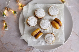 Low carb cookies with sugar free jam, sprinkled with powdered erythritol