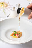 Raviolo with lobster and lobster bisque