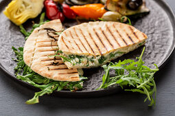 Mediterranean pita bread filled with cheese with grilled vegetables