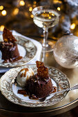 Sticky toffee pudding cake with pecan caramel sauce and ice cream