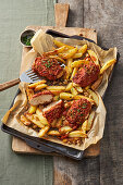 Roasted chicken with a walnut crust and potato wedges