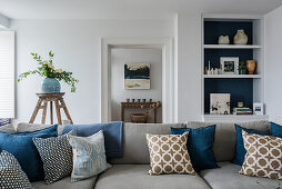 Pale grey sofa with scatter cushions