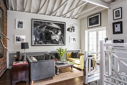 Two sofas facing one another in living room with open roof structure