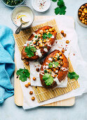 Baked sweet potatoes with roasted chickpeas and sour cream
