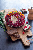 Cheese ball with haddock, dill and red currants
