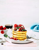 Pancakes with maple syrup and raspberries for Valentine's Day