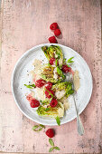 Fried lettuce hearts with raspberries and soy yogurt dressing