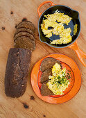 Homemade pumpernickel with scrambled eggs