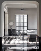 Modern, monochrome living room in luxurious period building