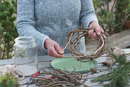 Wind light with twigs: Woman Winding Wreath from Clematis Vines