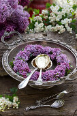 Wreath of lilac florets in silver dish
