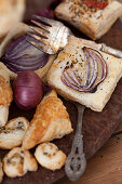 Puff pastry slices with red onions