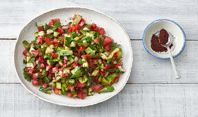 Turkish salad made with cucumber, tomato, pointed peppers and mint