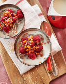 Buckwheat porridge with raspberries and sea buckthorn berries