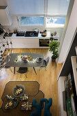 Overhead view of Christmas gifts laid out on the rug and a kitchen table