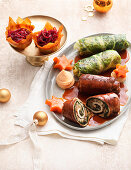 Veal rolls and savoy cabbage rolls with red cabbage baskets