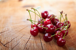 Fresh cherries on a wooden surface