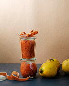 Homemade quince chutney in jars as gifts