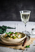 Risotto with asparagus and vegan 'feta' served with white wine