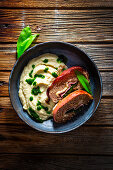 Wild garlic and meat rolls with mashed potatoes