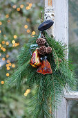 A natural Christmas arrangement on an old window