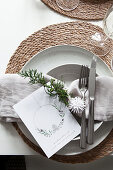 Christmas place setting with raffia placemat