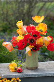 Spring bouquet of red and orange tulips