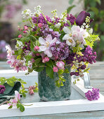 Spring bouquet of lilac, crabapple, lily of the valley, tulip, garlic mustard, and Chocolate vine