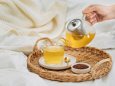 Buckwheat tea or kuqiaocha Healthy soba tea in glass cup, and glass teapot