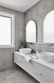 Washstand with twin countertop sinks below mirrors