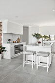 Island counter in elegant white kitchen