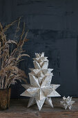 Table decoration with a Bascetta star, self-folded from old book pages