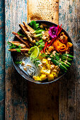 Asian vegetable glass noodle salad with mango