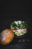 Burger with hallumi cheese, grilled asparagus and pickled onions