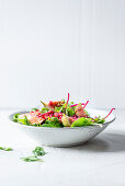 Wild herb salad with pomegranate seeds and figs