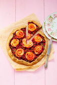 Raspberry and apple tart with pistachios and apple roses
