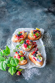 Sweet bruschetta with cream cheese and summer berries