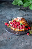 Croissant with raspberries and chocolate cream