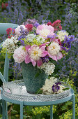 Colorful early summer bouquet of peonies, Multiflora rose, lady's mantle, Red valerian, Love-in-a-Mist, cranesbill, catmint, lupine, and elderberry