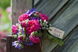 Bouquet of roses, cranesbills and ground elder as a greeting