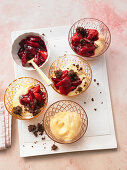 Vanilla pudding with strawberry compote and cocoa-and-almond crumble
