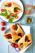 Savoury puff pastries with roasted peppers, asparagus and Parmesan
