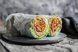 Burrito rolls with lettuce, meat and vegetables