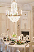 Festively set, bright Christmas table, above chandelier