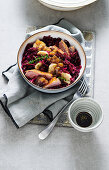Winter bowl with duck breast and pomegranate-orange-red cabbage