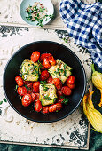 Courgette fish parcels with tomatoes